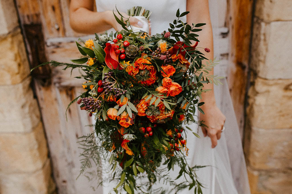 Gorgeous burnt orange floral wedding bouquet
