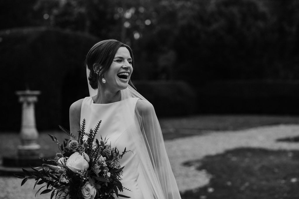 Black & white portrait of natural happy bride